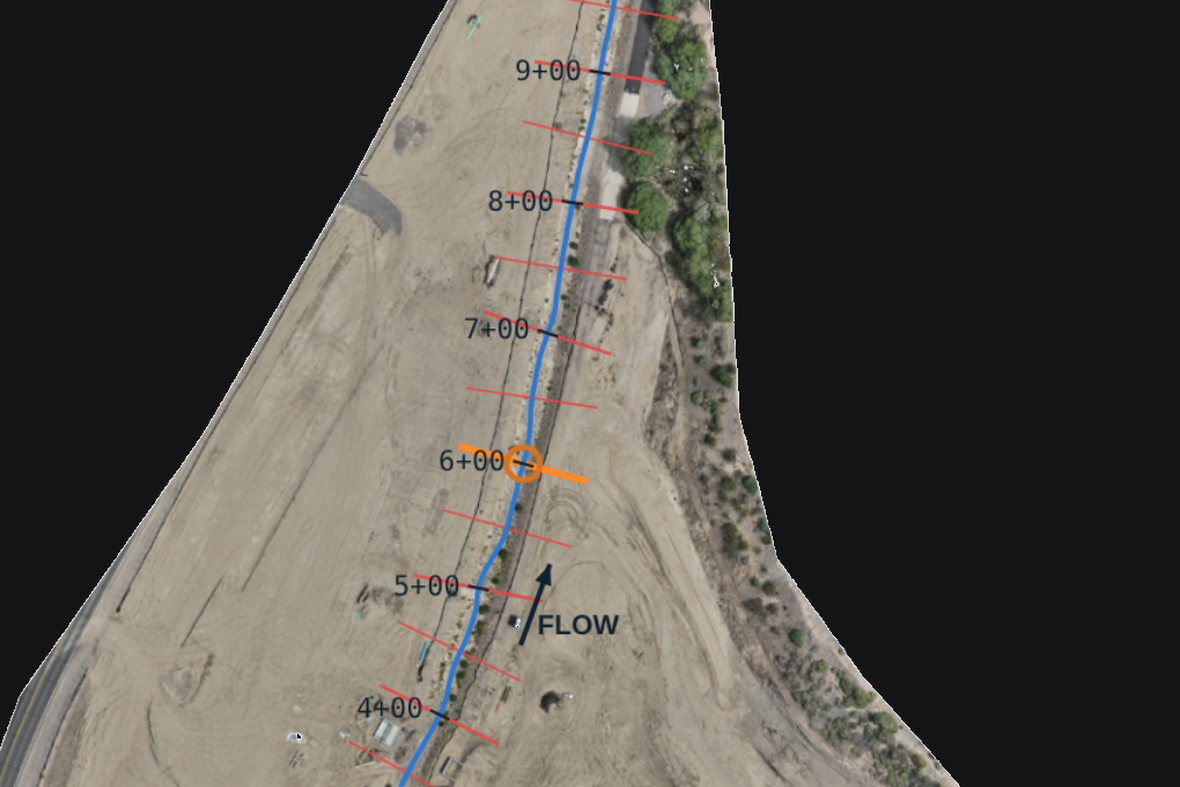 Graded construction site with drainage-channel centerline, stations every 50 ft and cross-section lines, from a Lurid X progress flight