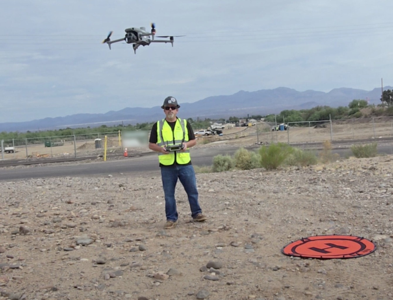 Lurid X drone operator at an industrial site in the Southwestern US